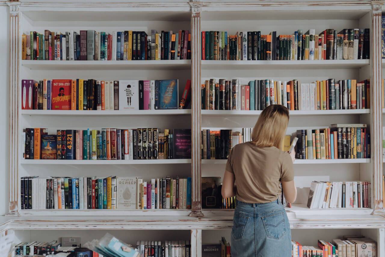 Woman standing in front of books